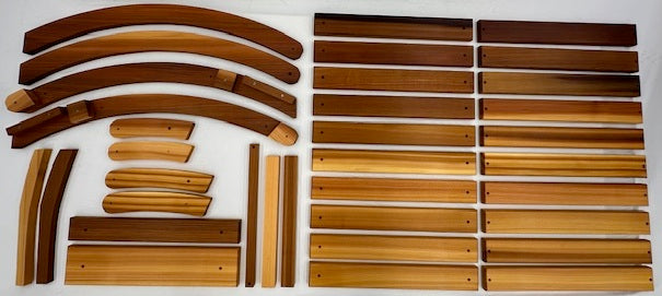 Unassembled Western Red Cedar lounger parts laid out before assembly