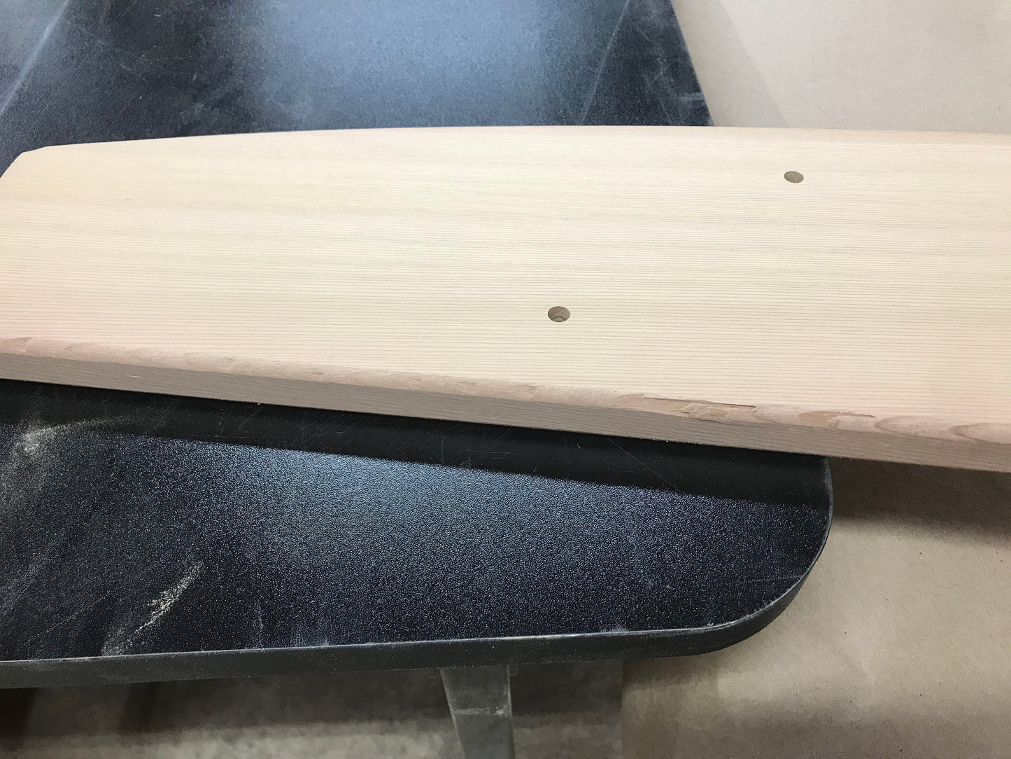 Example of a cosmetic edge imperfection on a cedar Adirondack chair part