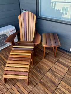 Western Red Cedar Adirondack chair with matching footrest and side table in a customer’s outdoor space
