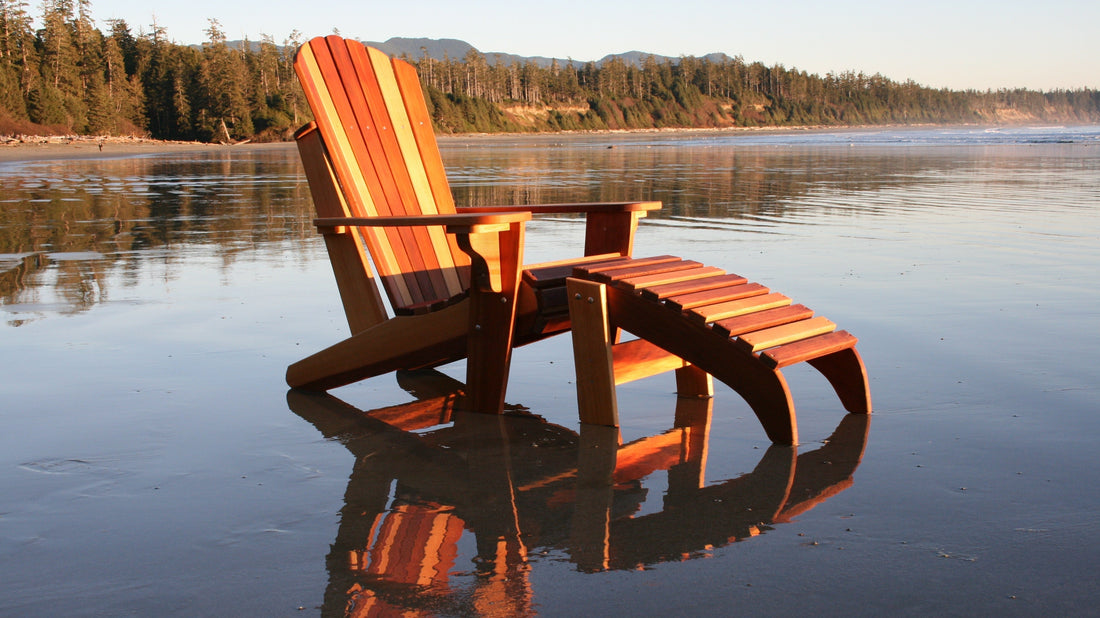Western Red Cedar Adirondack chair with matching footrest on a beach