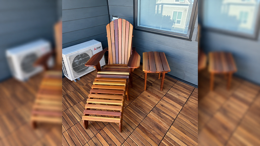 Cedar Adirondack chair with matching footrest and side table on a wooden balcony