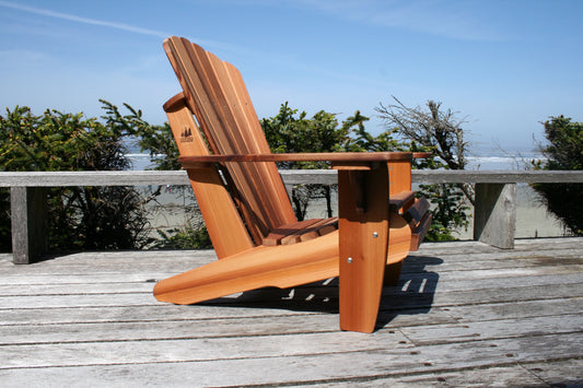 Side view of a cedar Adirondack or Muskoka chair showing its sloping seat and extended rear legs