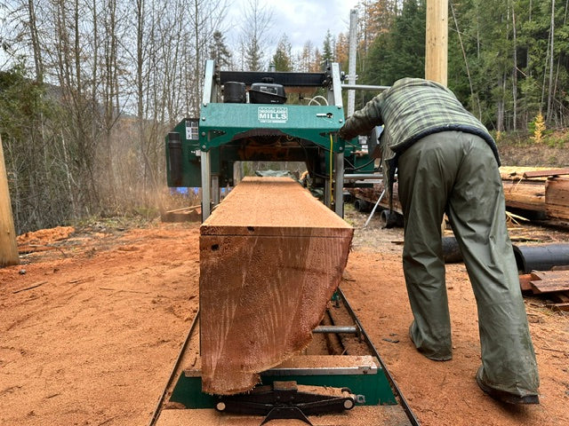 Old-growth Western Red Cedar log being quarter-sawn at Tofino Woodshop