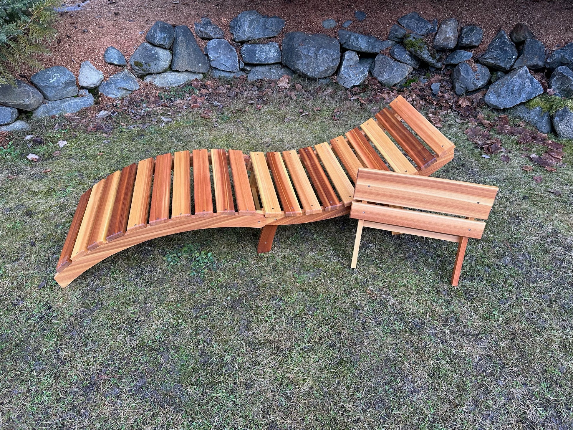 Cedar folding lounger with removable two-slat headrest shown separately