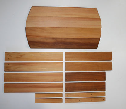 Side-table kit components arranged before assembly, showing the natural colour variation in the cedar