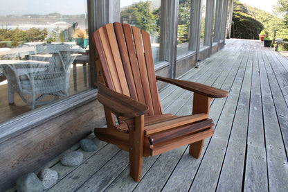 Front-angle view of the chair showing the curved back, wide arms and natural cedar colour variation