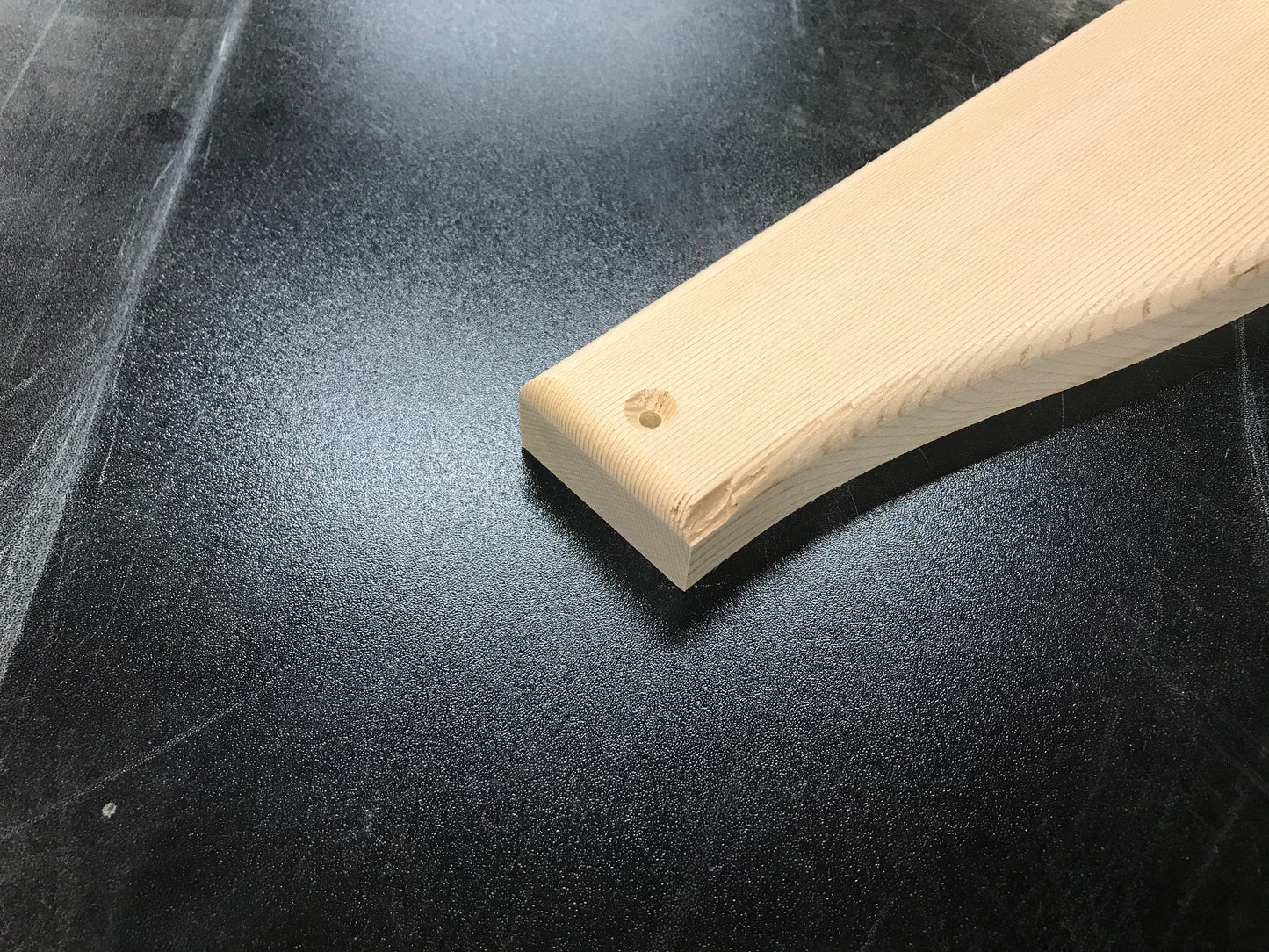 Example of a small edge chip on a cedar Adirondack chair part
