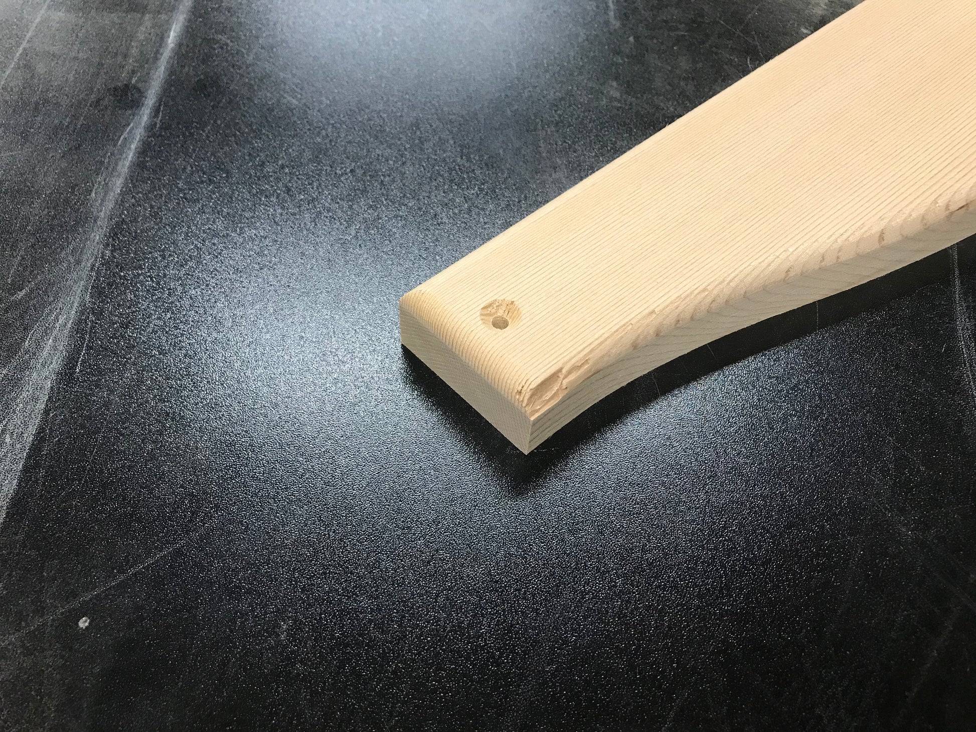 Example of a small edge chip on a cedar Adirondack chair part