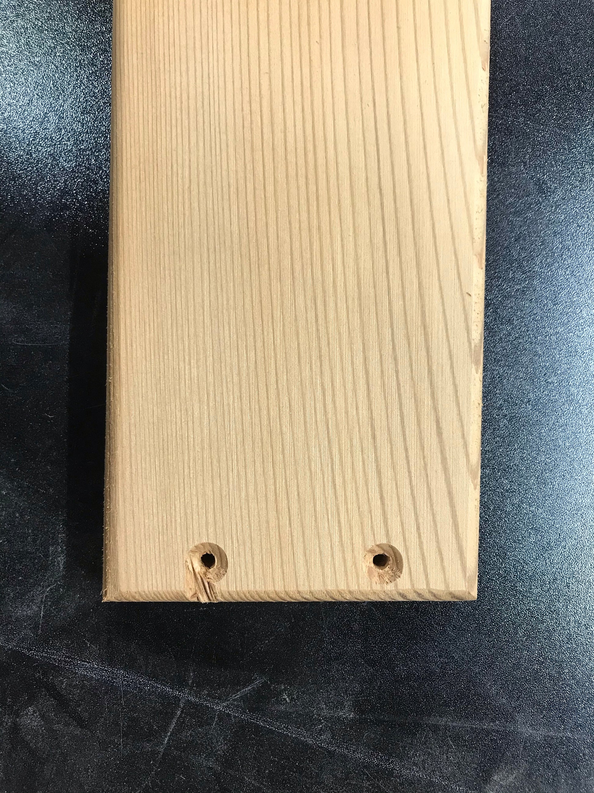 Example of a cosmetic machining imperfection on a cedar Adirondack chair part