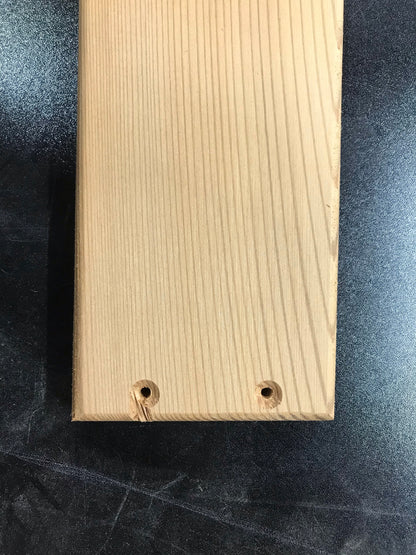 Example of a cosmetic machining imperfection on a cedar Adirondack chair part