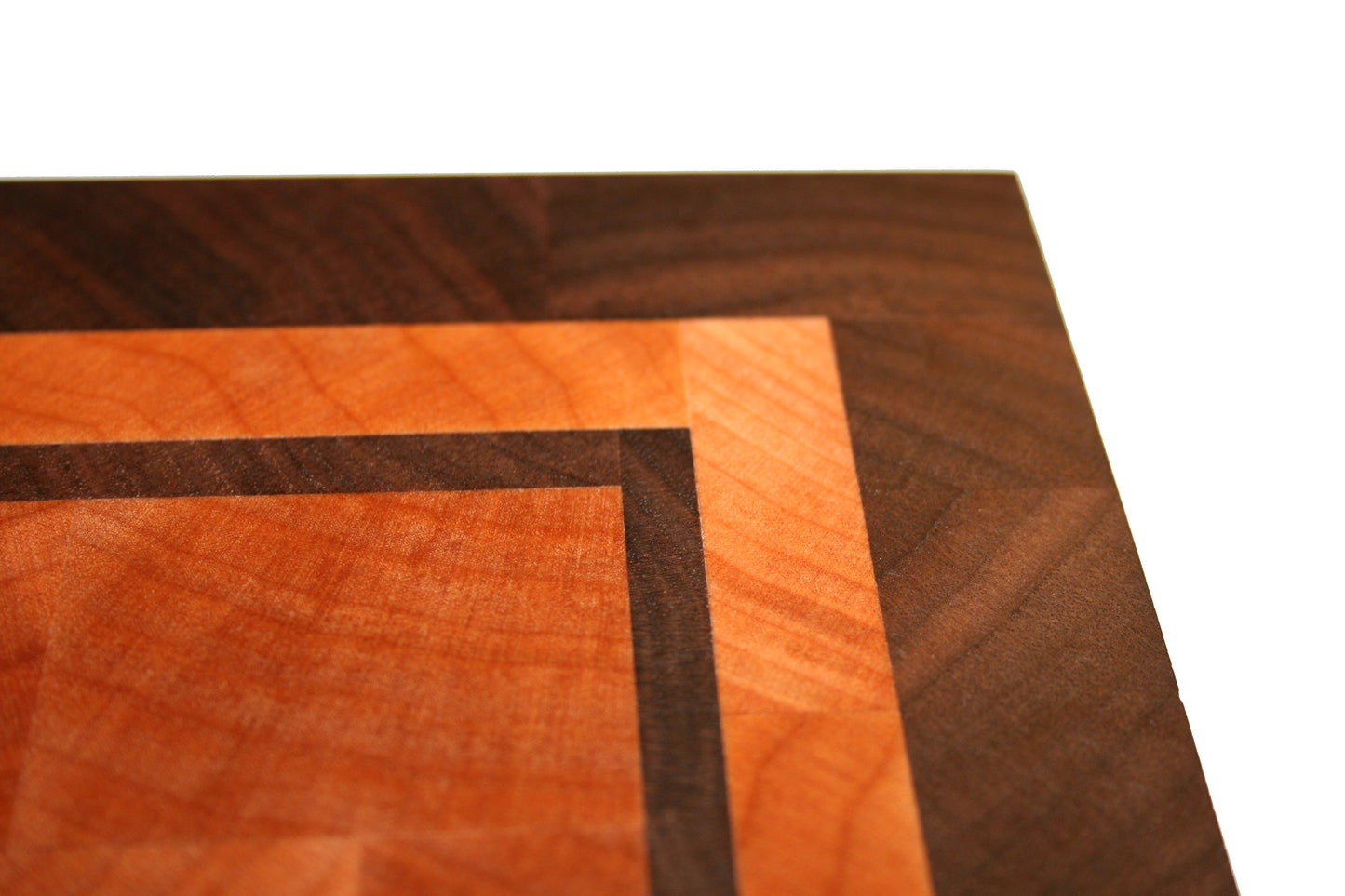 Close-up of the Eastern Maple and Black Walnut border and inset detail on the end-grain cutting board