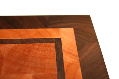 Close-up of the Eastern Maple and Black Walnut border and inset detail on the end-grain cutting board