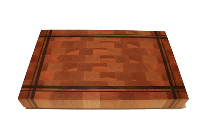 Front view of a striped Eastern Maple and Black Walnut end-grain cutting board