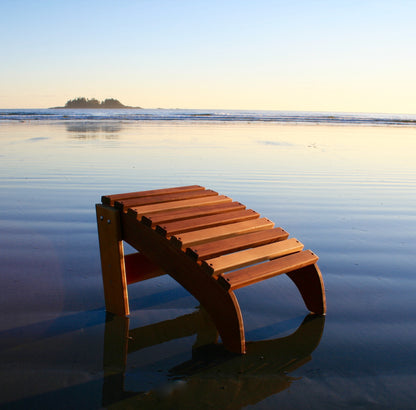 Western Red Cedar Adirondack footrest on a beach at low tide
